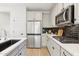 Updated kitchen with white countertops, modern appliances and sleek cabinetry at 6641 N Desert Shadow Ln, Phoenix, AZ 85014