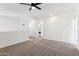 Large loft area with neutral carpet, recessed lighting, and easy access to the kitchen at 6641 N Desert Shadow Ln, Phoenix, AZ 85014