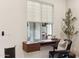 Cozy office nook with floating desk, black leather chair, and decorative elements at 6641 N Desert Shadow Ln, Phoenix, AZ 85014