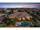 Expansive single-Gathering home with a private backyard oasis, featuring a sparkling pool and ample space for outdoor relaxation at 6918 E Ivyglen St, Mesa, AZ 85207