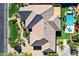 Aerial view of home showcasing roof, backyard swimming pool, and patio at 6918 E Ivyglen St, Mesa, AZ 85207