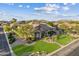 Captivating single-Gathering home in a serene neighborhood, boasting a lush lawn and meticulously maintained landscaping at 6918 E Ivyglen St, Mesa, AZ 85207
