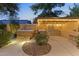 Outdoor kitchen and hot tub complete this backyard oasis with lush landscaping at 6918 E Ivyglen St, Mesa, AZ 85207