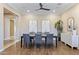 Elegant dining room featuring stylish decor, modern lighting, and a chic buffet table at 6918 E Ivyglen St, Mesa, AZ 85207