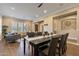 Well-lit dining area showcasing modern decor, an open layout, and seamless connection to the adjacent living space at 6918 E Ivyglen St, Mesa, AZ 85207