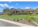 Inviting single-Gathering home with meticulous landscaping and a well-manicured lawn at 6918 E Ivyglen St, Mesa, AZ 85207