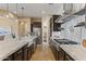 Beautiful kitchen featuring granite counters, an island with seating, stainless steel appliances and ample cabinet space at 6918 E Ivyglen St, Mesa, AZ 85207