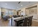 Open-concept layout seamlessly connects dining area and living room, ideal for entertaining at 6918 E Ivyglen St, Mesa, AZ 85207