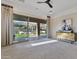 Light-filled main bedroom with sliding glass doors opening to views of the backyard with a pool at 6918 E Ivyglen St, Mesa, AZ 85207