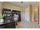 Bright home office with wood-look floors, built-in bookcase, and spacious desk at 6918 E Ivyglen St, Mesa, AZ 85207