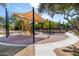 Community playground with shade, slide, and climbing features near basketball court at 6918 E Ivyglen St, Mesa, AZ 85207