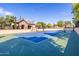 Community tennis court with professional surfacing and lighting at 6918 E Ivyglen St, Mesa, AZ 85207