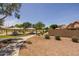 Community park featuring covered picnic tables, playground and landscaped grounds at 7701 E Portobello Ave, Mesa, AZ 85212