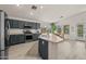 Modern kitchen featuring stainless steel appliances and beautiful dark gray cabinets at 7701 E Portobello Ave, Mesa, AZ 85212