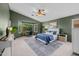 Spacious primary bedroom with a bay window sitting area and a large, comfortable bed at 7701 E Portobello Ave, Mesa, AZ 85212