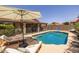 Relaxing backyard with swimming pool and lounge chairs at 7701 E Portobello Ave, Mesa, AZ 85212