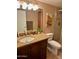 Bathroom featuring a vanity with granite countertop, tile shower, and toilet at 7960 E Camelback Rd # 109, Scottsdale, AZ 85251