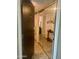Entryway featuring mirrored closet, decorative wall art, and wood-look tile flooring at 7960 E Camelback Rd # 109, Scottsdale, AZ 85251