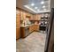 Kitchen featuring stainless steel appliances, wood cabinets and granite countertops at 7960 E Camelback Rd # 109, Scottsdale, AZ 85251