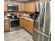 Stainless steel refrigerator and appliances paired with wood cabinets in the kitchen at 7960 E Camelback Rd # 109, Scottsdale, AZ 85251