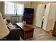 Inviting living room featuring a fireplace, comfortable seating, and ample natural light at 7960 E Camelback Rd # 109, Scottsdale, AZ 85251