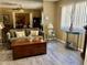 Bright living room with comfortable seating, a wooden coffee table, and a large mirrored wall at 7960 E Camelback Rd # 109, Scottsdale, AZ 85251