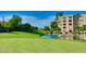 Scenic view of community with pond and fountain, creating a relaxing and picturesque setting at 7960 E Camelback Rd # 109, Scottsdale, AZ 85251