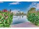 Scenic view of pond with fountains and lush landscaping at 7960 E Camelback Rd # 109, Scottsdale, AZ 85251
