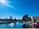 Scenic view of a pond with fountains, surrounded by landscaping and condominium buildings at 7960 E Camelback Rd # 109, Scottsdale, AZ 85251