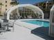 Inviting pool with enclosed patio and ample seating at 7960 E Camelback Rd # 109, Scottsdale, AZ 85251