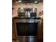 Stainless steel electric stove with granite countertops and tile backsplash at 7960 E Camelback Rd # 109, Scottsdale, AZ 85251