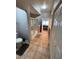 Bathroom featuring tile floors, glass-enclosed shower, and a view into the main bedroom at 8245 E Bell Rd # 103, Scottsdale, AZ 85260