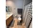 Traditional bathroom featuring tile flooring, a shower/tub combo, and neutral color palette at 8245 E Bell Rd # 103, Scottsdale, AZ 85260