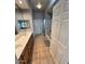 Spacious bathroom with dual sinks, tile floors, and a separate glass-enclosed shower at 8245 E Bell Rd # 103, Scottsdale, AZ 85260