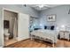 Bright bedroom featuring hardwood floors, attached bathroom and closet at 8245 E Bell Rd # 103, Scottsdale, AZ 85260