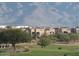 Residential complex with beautiful mountain views and lush landscaping at 8245 E Bell Rd # 103, Scottsdale, AZ 85260