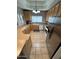 Bright kitchen with a large window, stainless steel appliances, and plenty of counter space at 8245 E Bell Rd # 103, Scottsdale, AZ 85260
