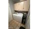 Functional laundry area with washer, dryer, and storage cabinets, providing convenience and organization at 8245 E Bell Rd # 103, Scottsdale, AZ 85260