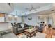 Inviting living room featuring wood floors, neutral paint and comfortable seating arrangements at 8245 E Bell Rd # 103, Scottsdale, AZ 85260