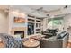 Comfortable living room featuring built-in shelving and a fireplace at 8245 E Bell Rd # 103, Scottsdale, AZ 85260