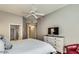 Bright main bedroom featuring hardwood floors, TV and comfortable furnishings at 8245 E Bell Rd # 103, Scottsdale, AZ 85260