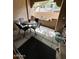 Cozy outdoor patio space with table and chairs, perfect for relaxing or entertaining guests in a private setting at 8245 E Bell Rd # 103, Scottsdale, AZ 85260