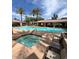 Sparkling community pool and hot tub surrounded by comfortable seating and lush landscaping, ideal for leisure at 8245 E Bell Rd # 103, Scottsdale, AZ 85260