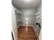 Well-organized walk-in closet with built-in shelving and hanging rods, maximizing storage space and efficiency at 8245 E Bell Rd # 103, Scottsdale, AZ 85260