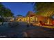 Inviting outdoor space with a fire pit, seating, desert landscape, and open-air access at 8248 E Arroyo Hondo Rd, Scottsdale, AZ 85266
