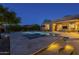 Stunning backyard featuring a pool, spa, covered patio, and outdoor living area with TV at 8248 E Arroyo Hondo Rd, Scottsdale, AZ 85266