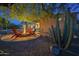 Cozy backyard fire pit area with comfortable seating and beautiful desert landscaping at 8248 E Arroyo Hondo Rd, Scottsdale, AZ 85266