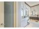 The bathroom features vanity cabinets with framed mirrors, drawers, granite countertops, and seamless access to the closet at 8248 E Arroyo Hondo Rd, Scottsdale, AZ 85266