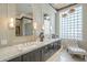 Luxurious bathroom with double vanity, granite counters, and modern lighting at 8248 E Arroyo Hondo Rd, Scottsdale, AZ 85266