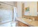 Bathroom features tiled walls, a shower-tub combo, and a vanity with tiled countertop at 8248 E Arroyo Hondo Rd, Scottsdale, AZ 85266
